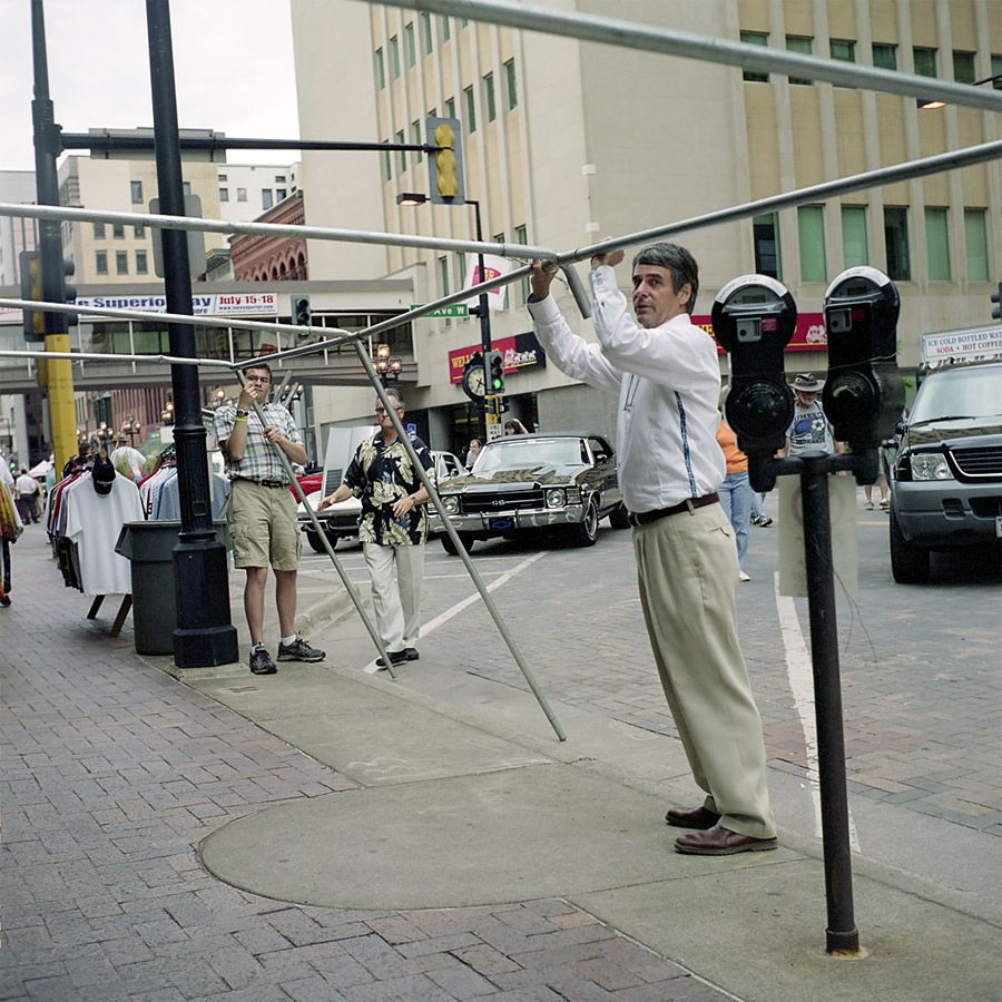 A Man Holding Up Some Pipes, Duluth, Minnesota, July 2010