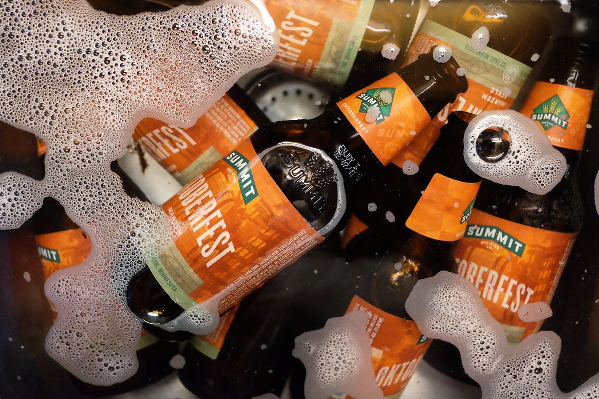 Summit bottles soaking to be delabelled