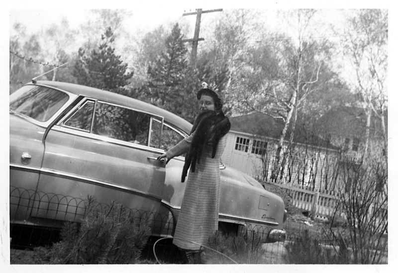 Woman entering a car
