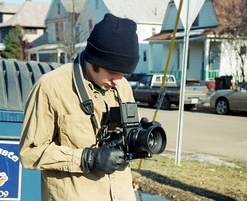 Hand holding a Mamiya RB67