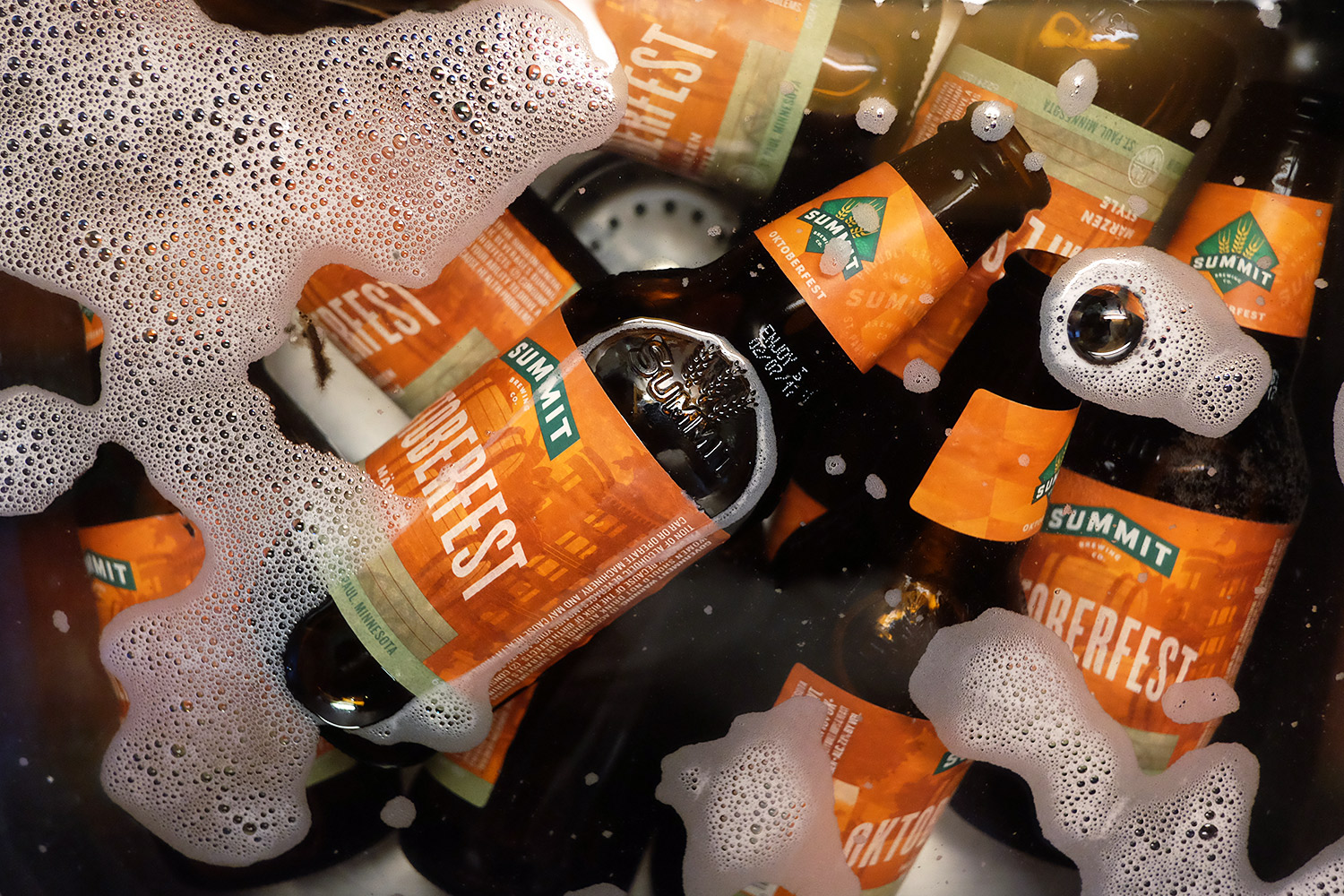 Summit bottles soaking to be delabelled