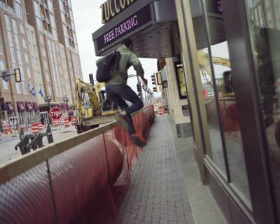 Man Leaping Over A Construction Barricade, Duluth, Minnesota, May 2011